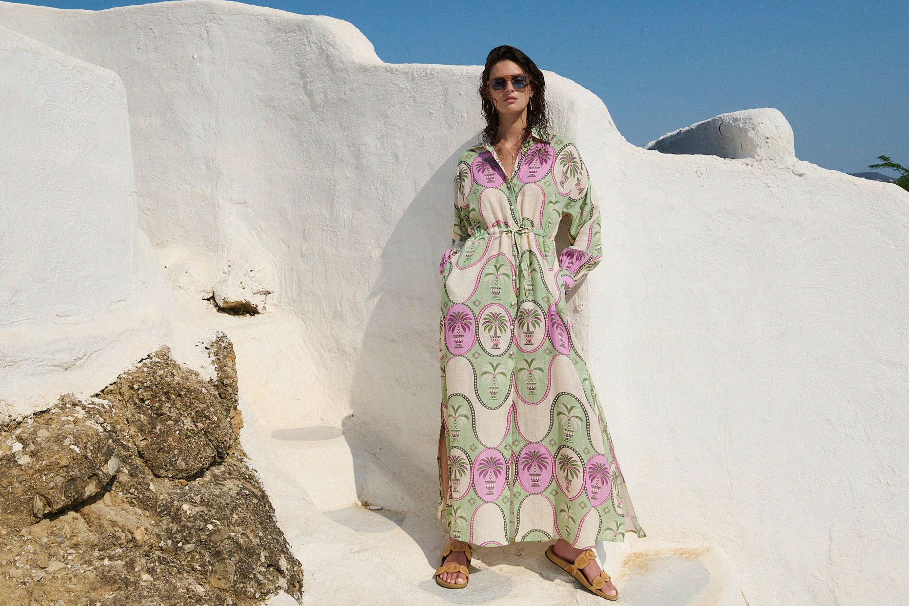 woman wearing long sleeve dress with palm tree print